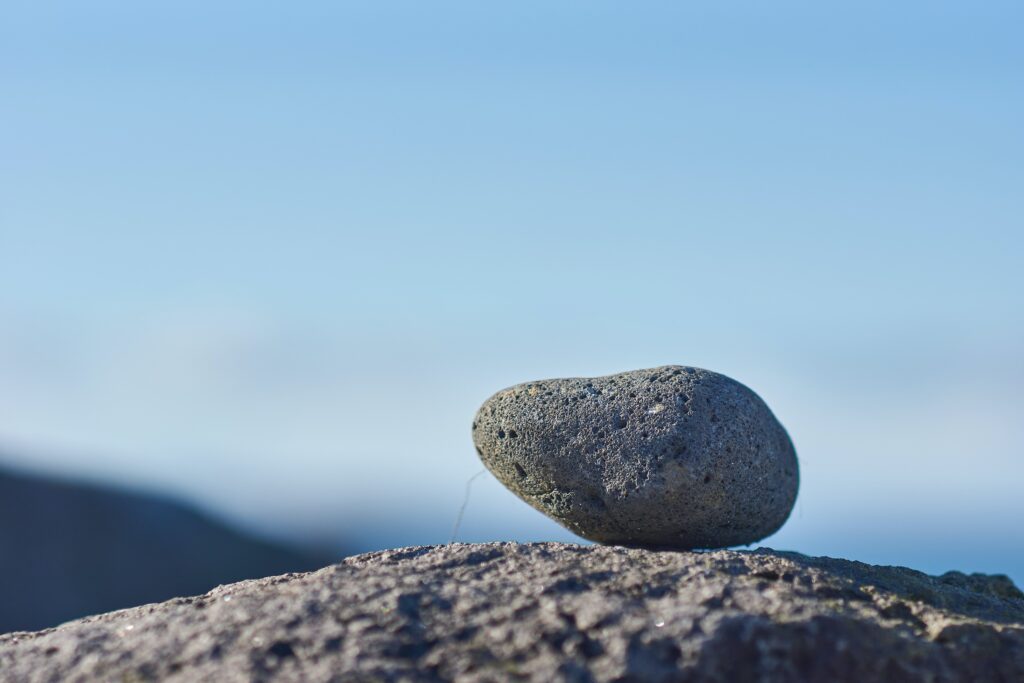 picture of a grey rock on top of another rock