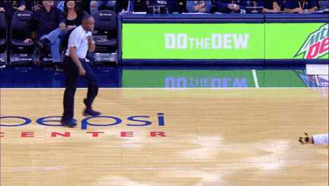 gif of a basketball referee dancing on the court using lots of footwork and body twisting
