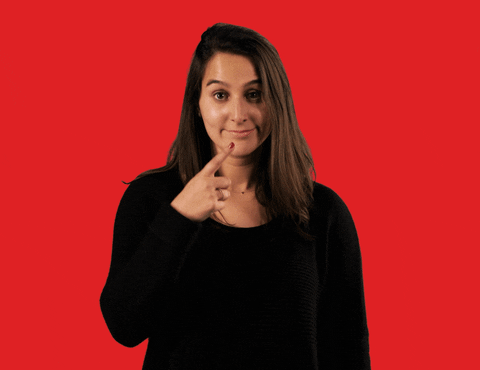 gif of a woman pointing at her nose and shaking her head no. 